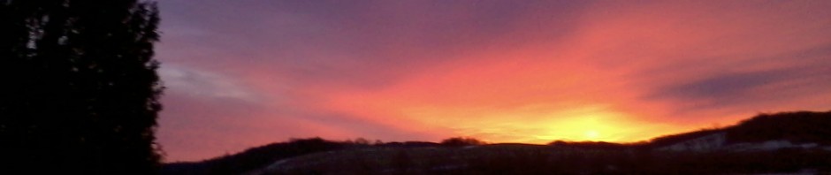 red sky over snowy fields