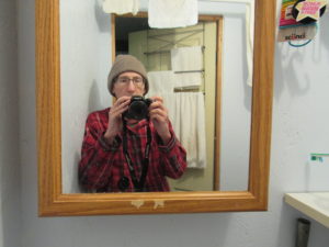 photo of author using mirror