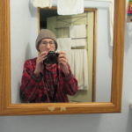 photo of author using mirror